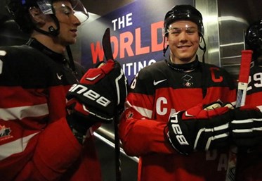 TORONTO, CANADA - JANUARY 2: Canada's Curtis Lazar #26, Shea Theodore #6 and teammates get set to take on Denmark during quarterfinal round action at the 2015 IIHF World Junior Championship. (Photo by Andre Ringuette/HHOF-IIHF Images)